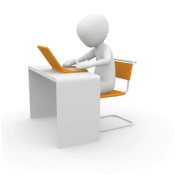 Picture of figure at desk using laptop